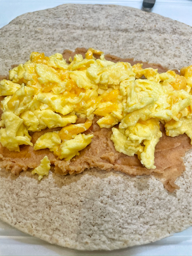 Adding Eggs to Breakfast Burrito